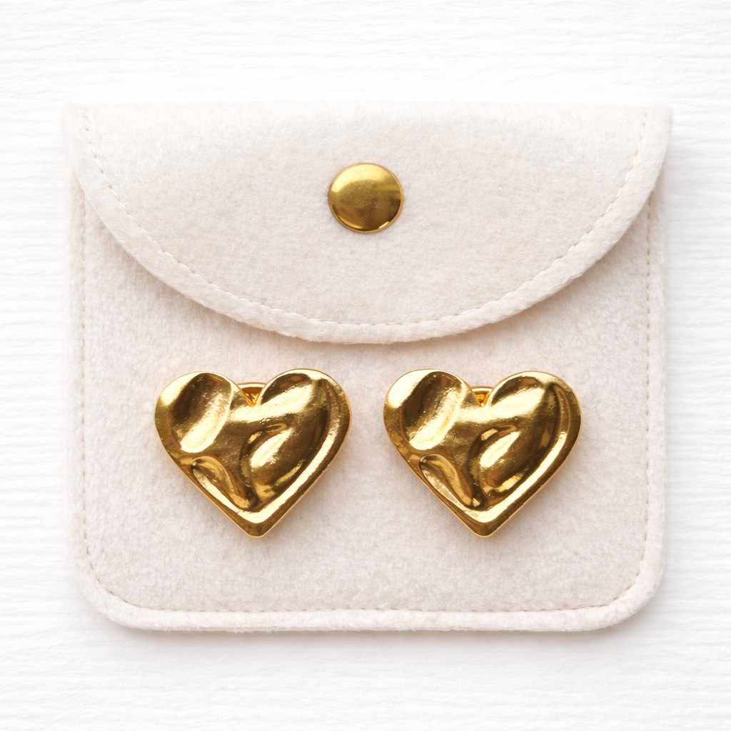 Coco Plutee gold heart buttons in cream pouch packaging