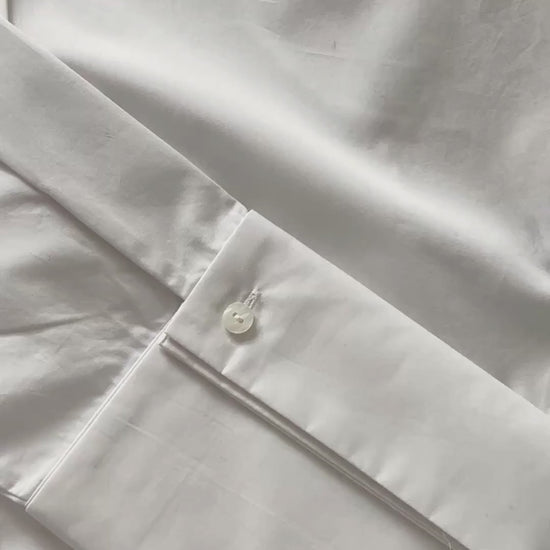 Plutee shirt buttons being clipped onto a shirt