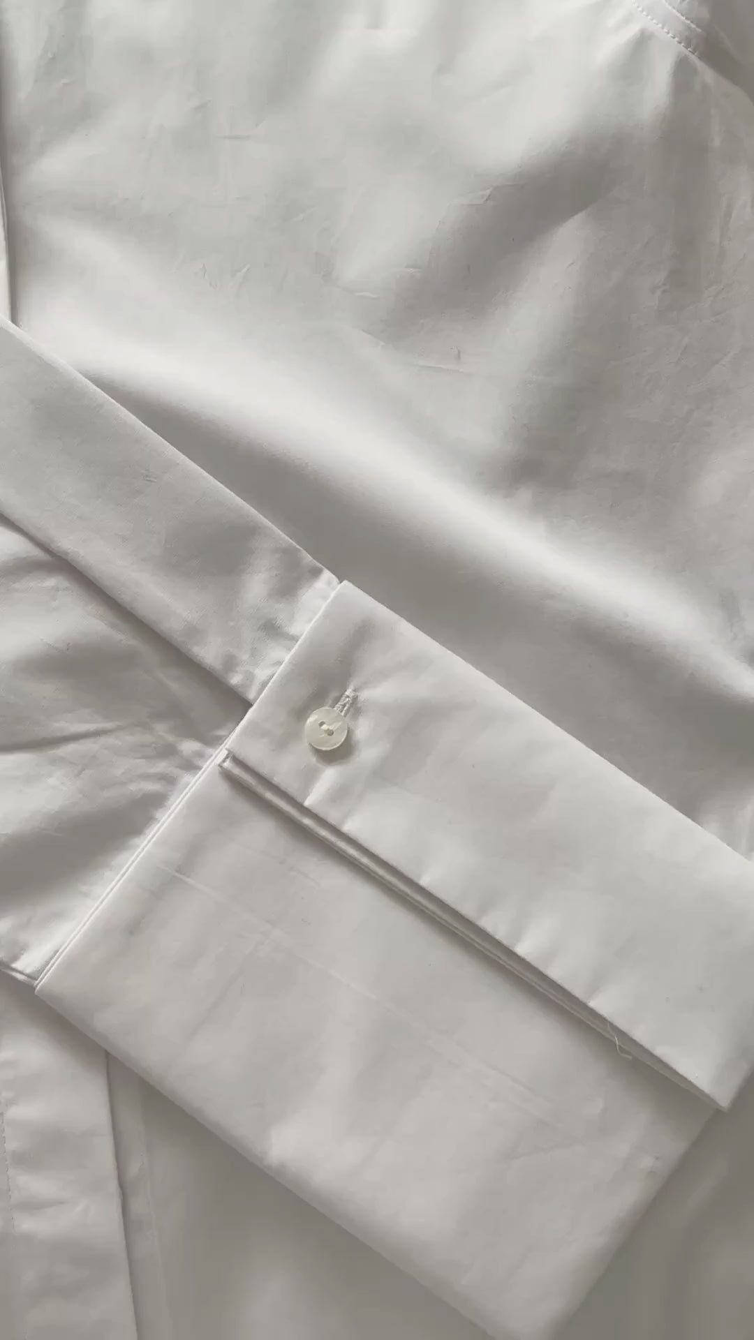 Plutee shirt buttons being clipped onto a shirt